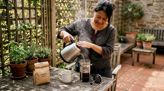 Woman brewing Sumatra decaf coffee in kitchen