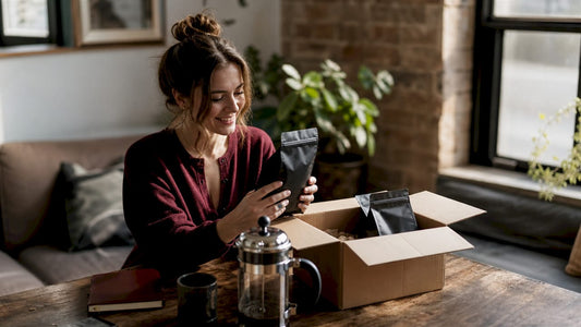 Woman unboxing specialty coffee subscription kit