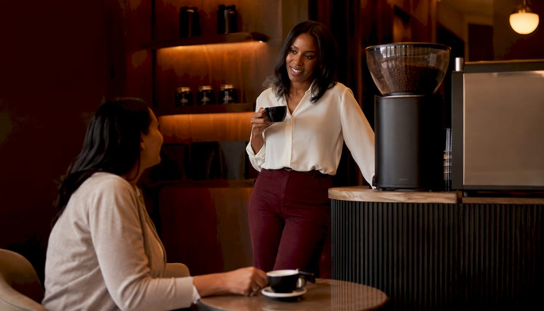 Colleagues enjoying premium coffee at office coffee station
