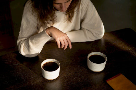 Two coffee cups compared at breakfast