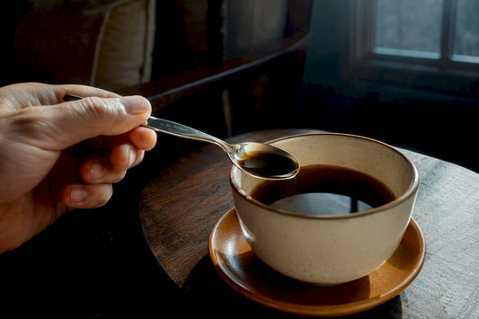 Decaf coffee measured beside ceramic cup