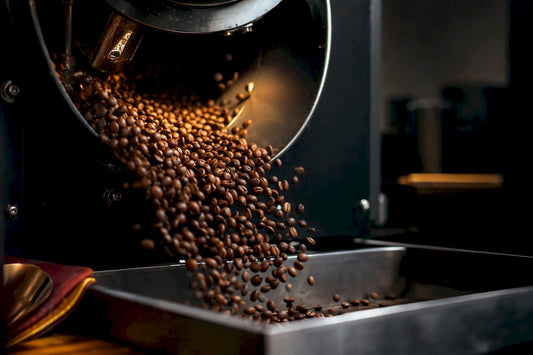 Coffee beans tumbling inside a roasting drum